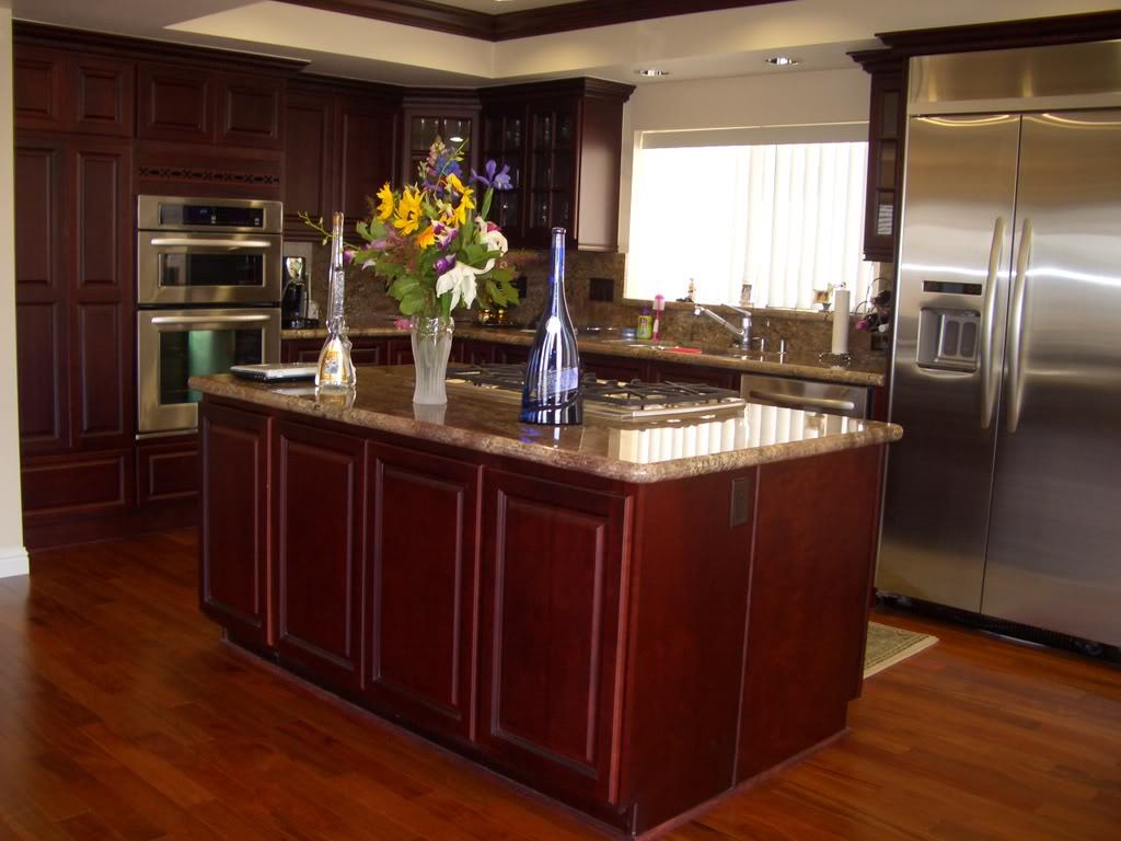 Custom designed kitchen cabinets and premium countertops by RiverBend Cabinetry